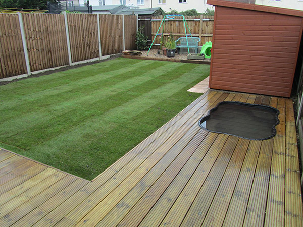 Decking and pond by NCB Gardens