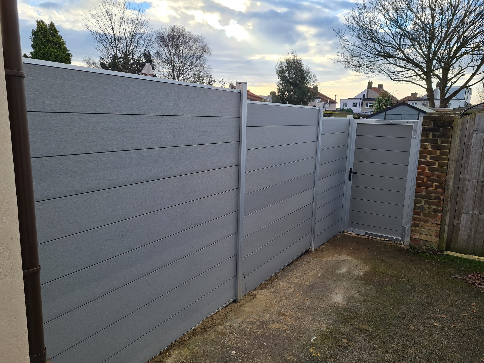 Modern grey composite fencing with matching gate