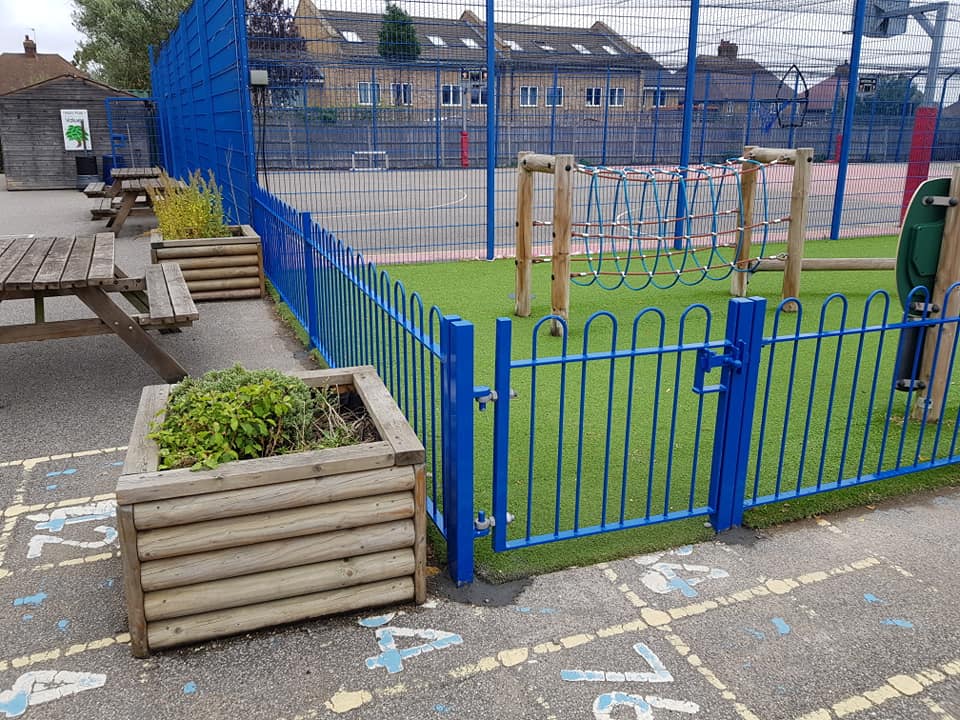 Blue security fencing installed at a school